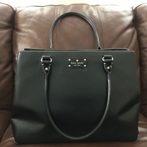 Kate Spade black leather tote bag with pink dot lining.